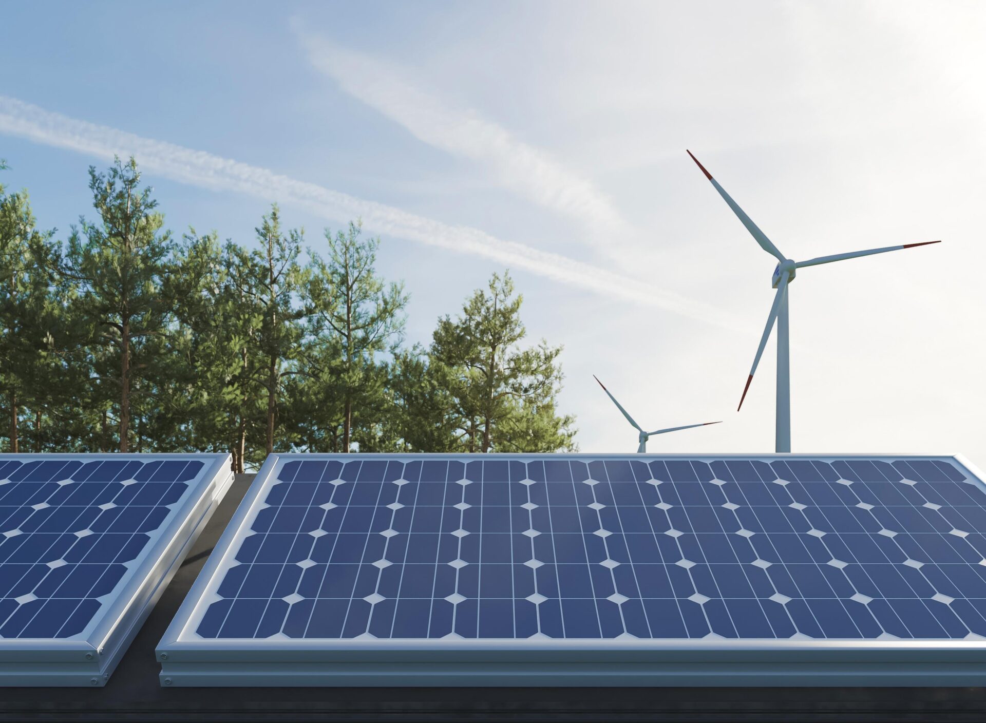 Solar panels and wind turbines generating clean renewable energy surrounded by trees under a clear sky.
