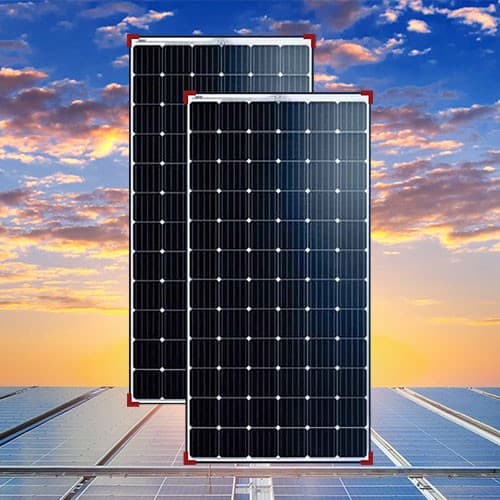 High-efficiency monocrystalline solar panels with sunset background.