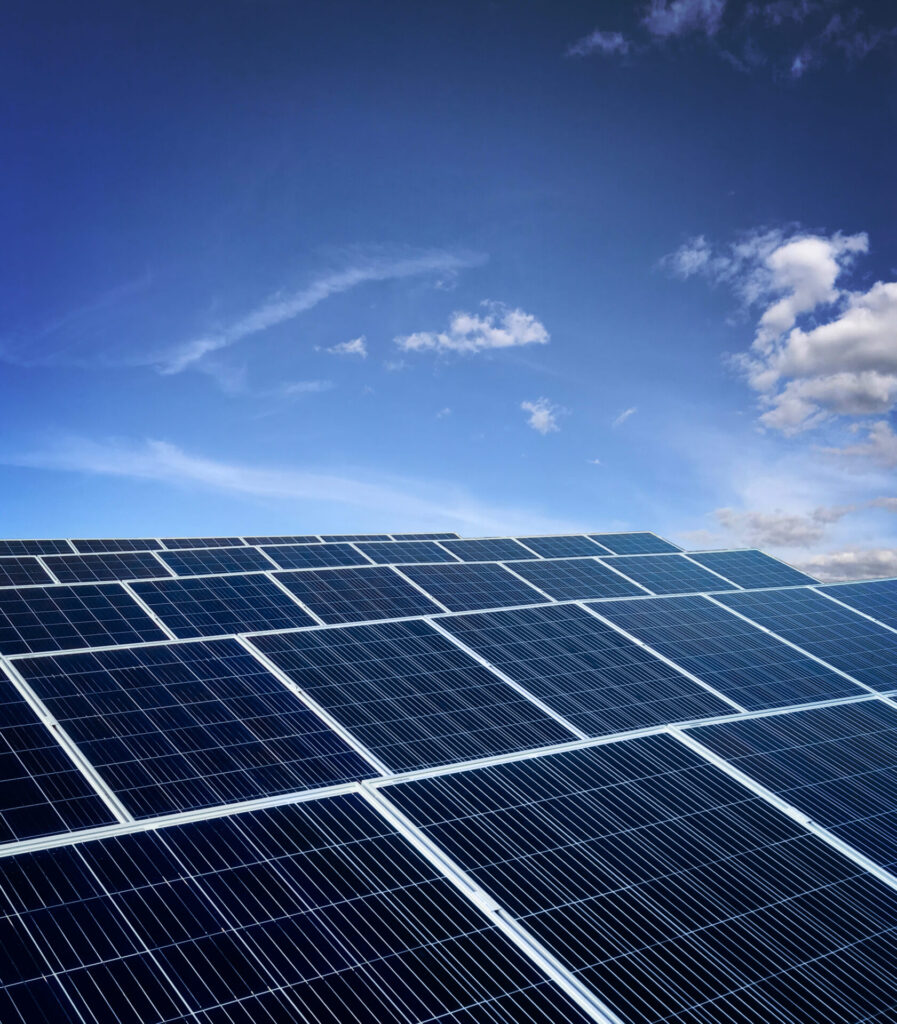 Large array of solar panels installed under clear skies for maximum solar power generation.