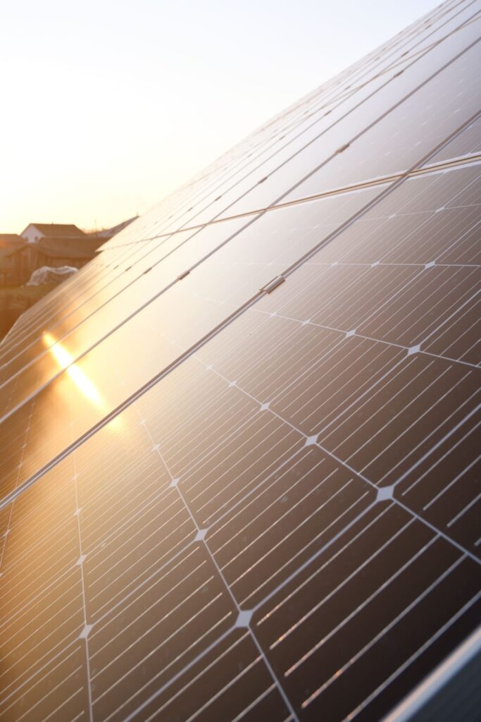 Close-up of residential solar panels absorbing sunlight during sunset – sustainable energy solution for homes.